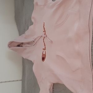 Pink champion sweater in a size xs